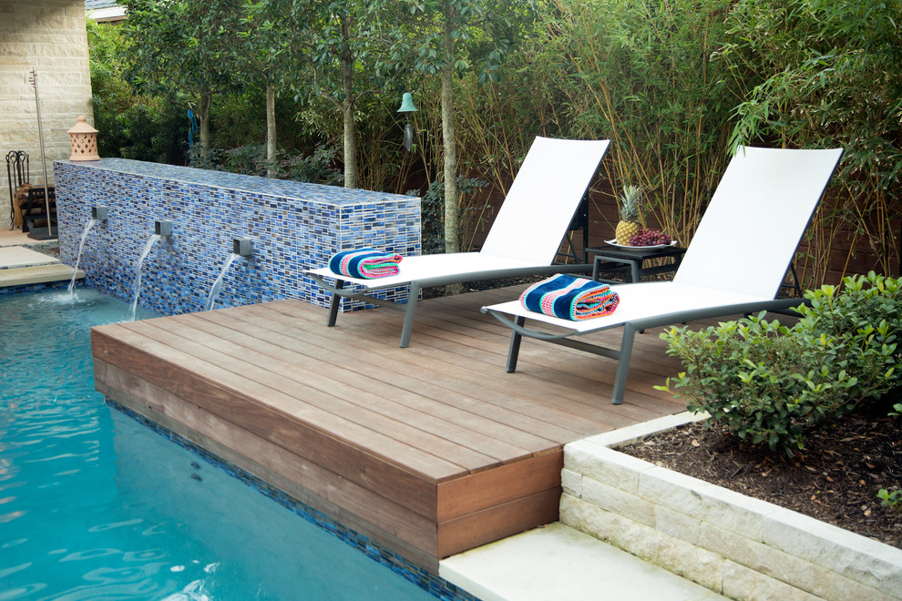Design ideas for a medium sized modern back rectangular swimming pool in Dallas.