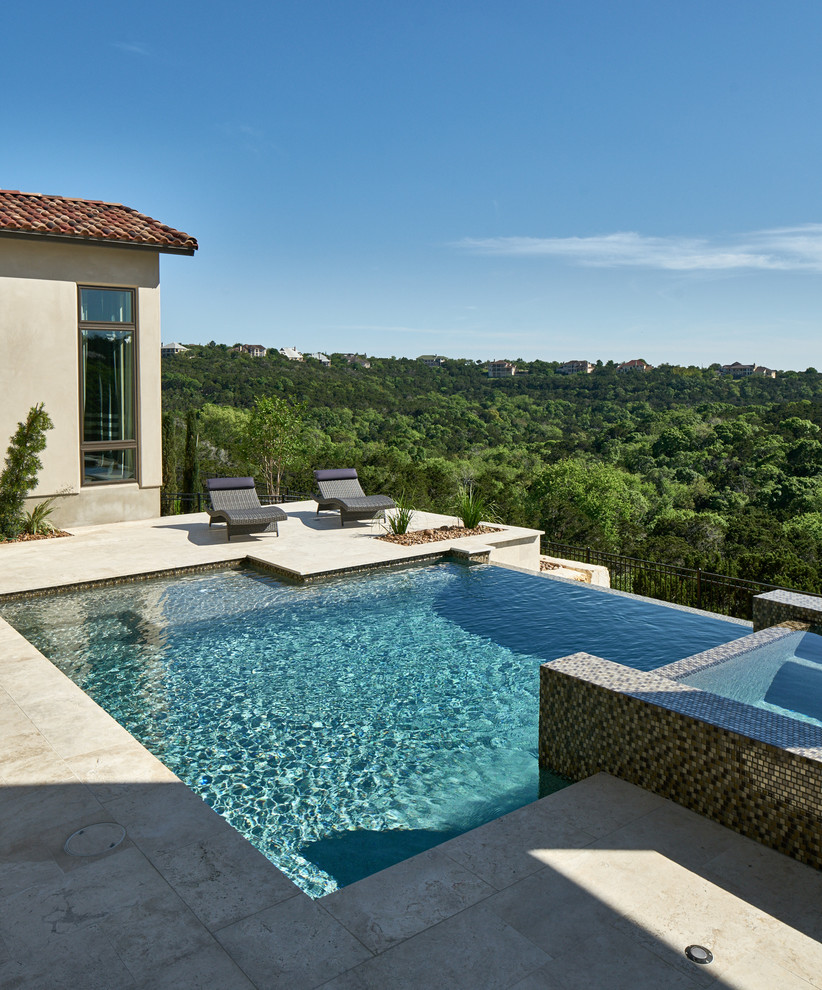 This is an example of a medium sized contemporary back infinity swimming pool in Other.