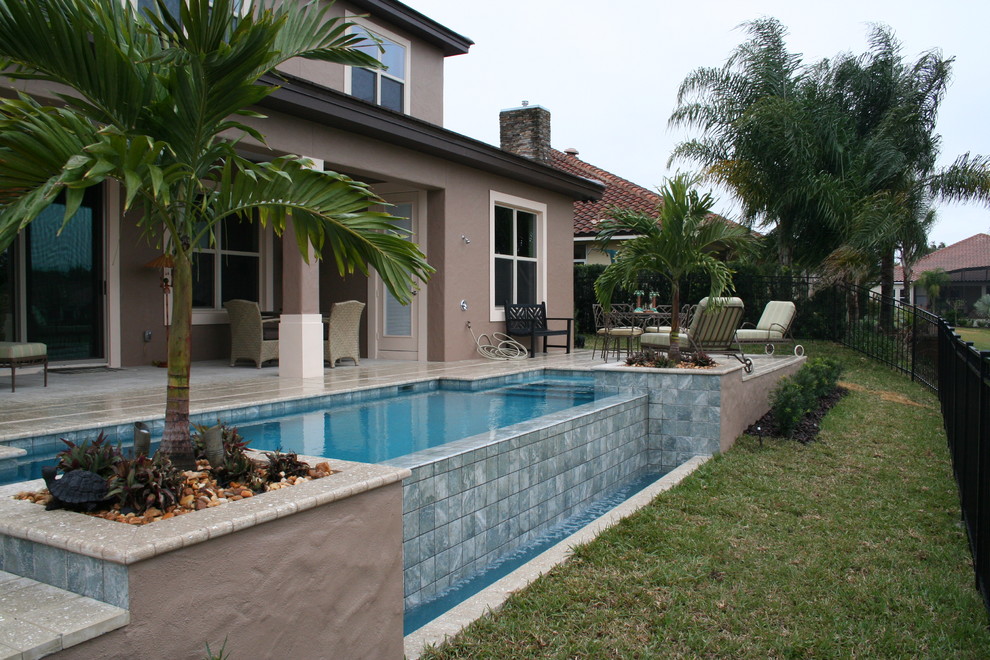 Example of a beach style pool design in Orlando