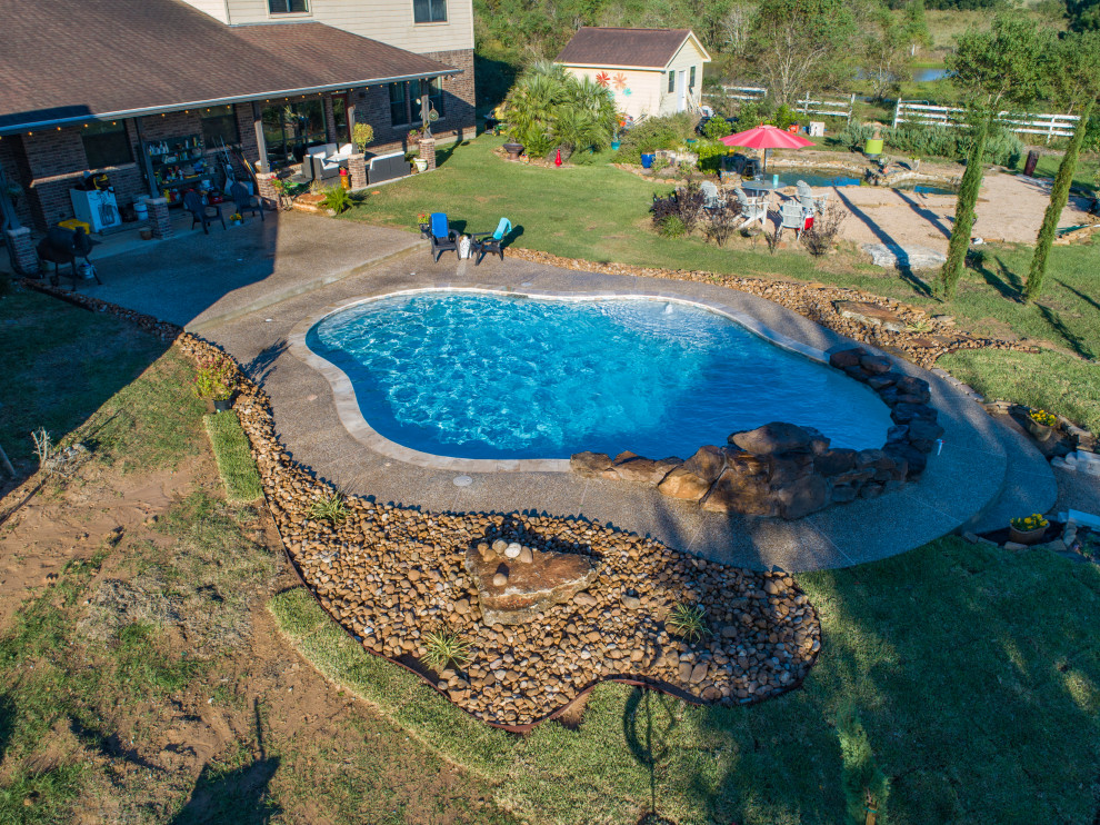 Berry Family Rustic Pool Houston by Richard's Total Backyard