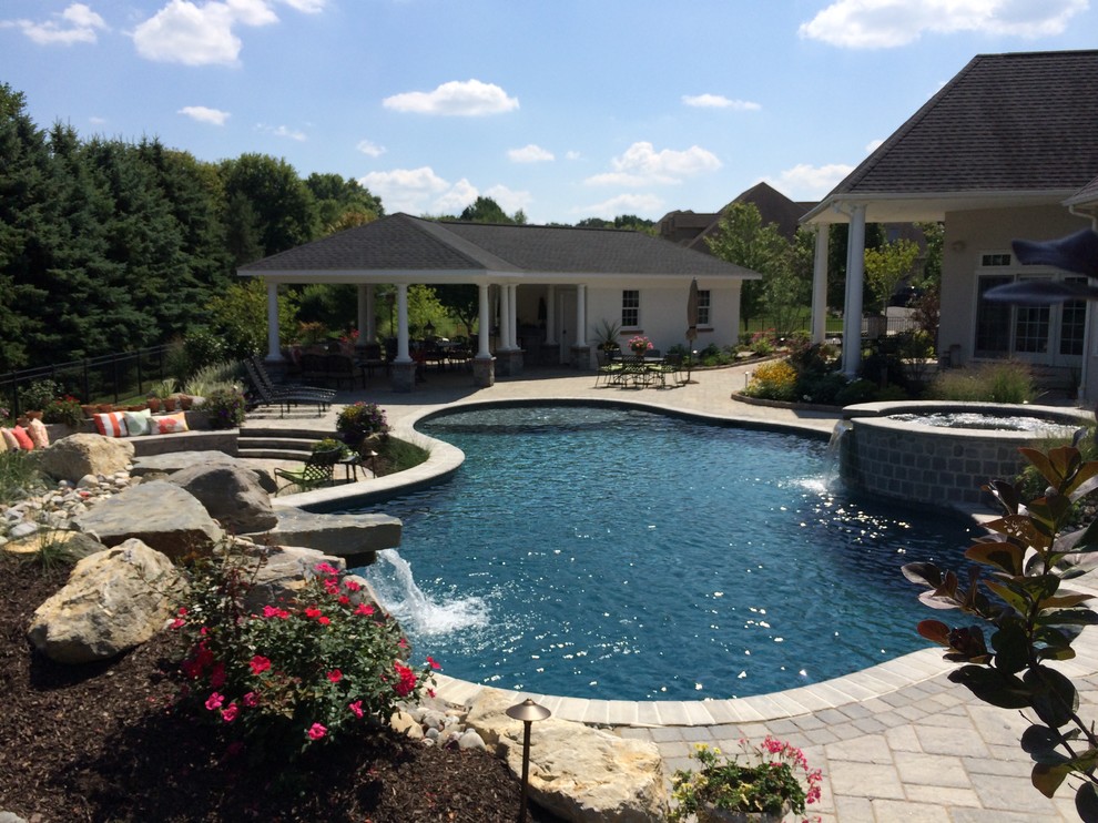 Bethlehem Township pool and spa with waterfall and sunshelf