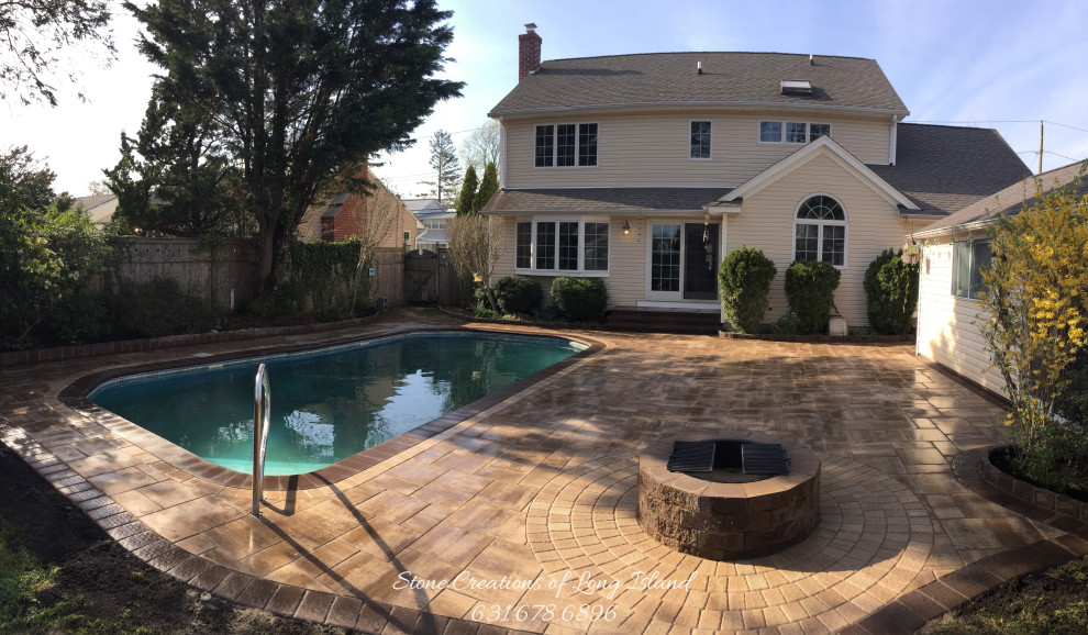 Design ideas for a large mediterranean back custom shaped lengths swimming pool in New York with a pool house and concrete paving.