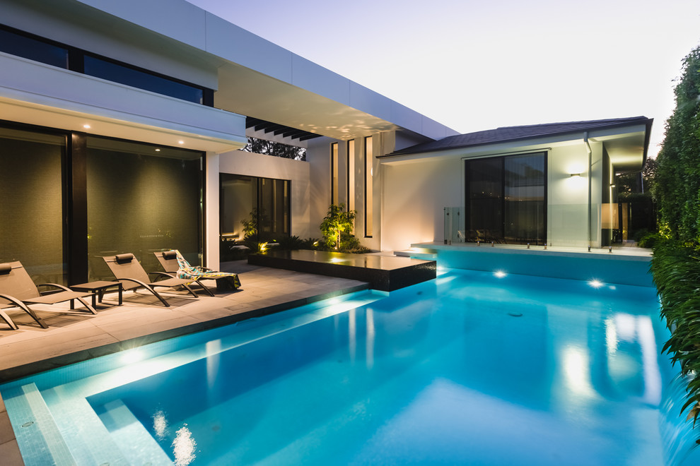 Small modern back custom shaped swimming pool in Melbourne.