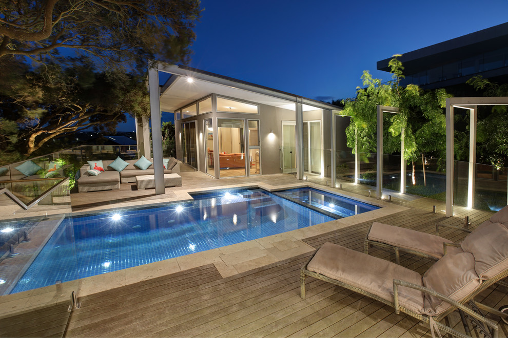 Trendy rectangular hot tub photo in Melbourne with decking