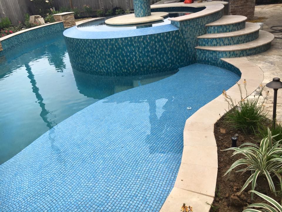 Inspiration for a mediterranean back custom shaped swimming pool in Houston.