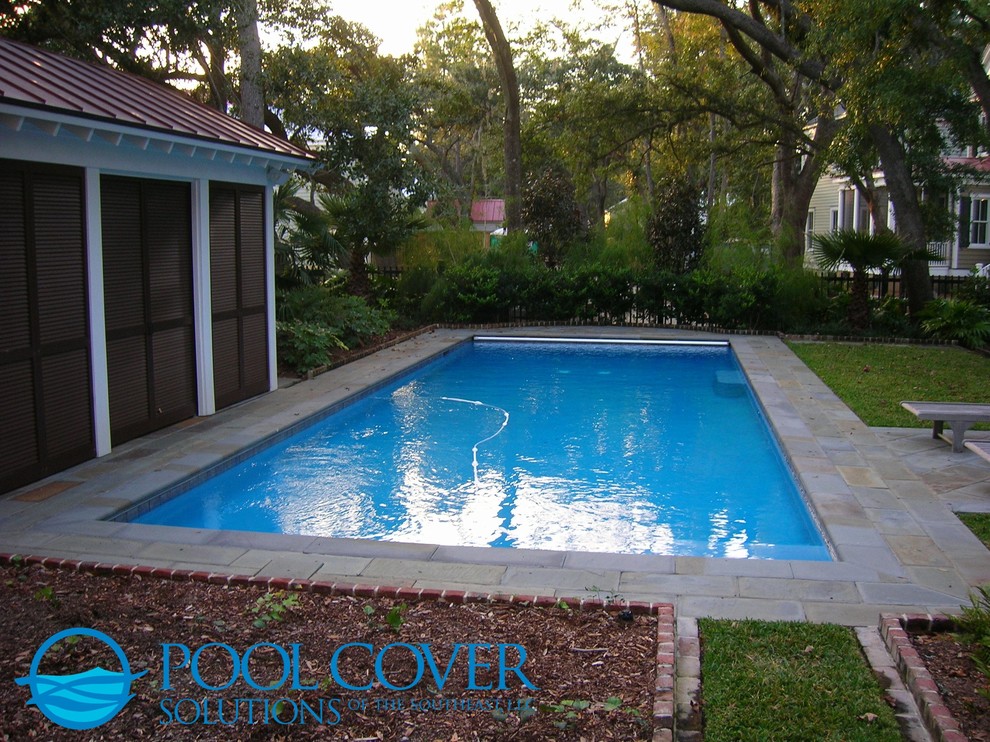 Medium sized classic courtyard rectangular swimming pool in Charleston with natural stone paving.