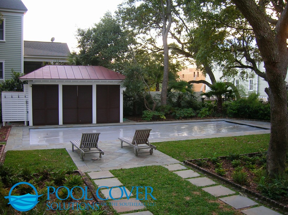 Example of a mid-sized classic courtyard stone and rectangular natural pool design in Charleston