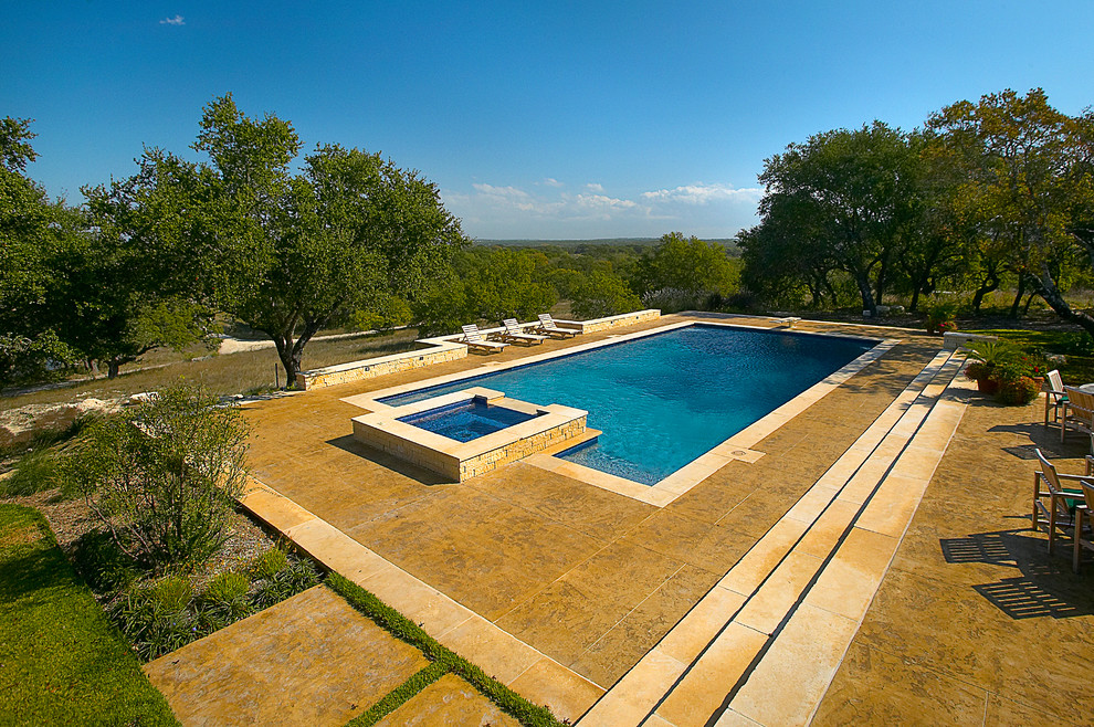 Pool - huge traditional backyard concrete and rectangular lap pool idea in Austin
