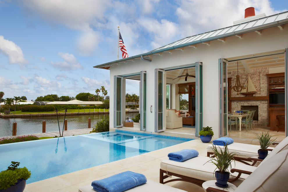 Example of an island style rectangular infinity hot tub design in Other