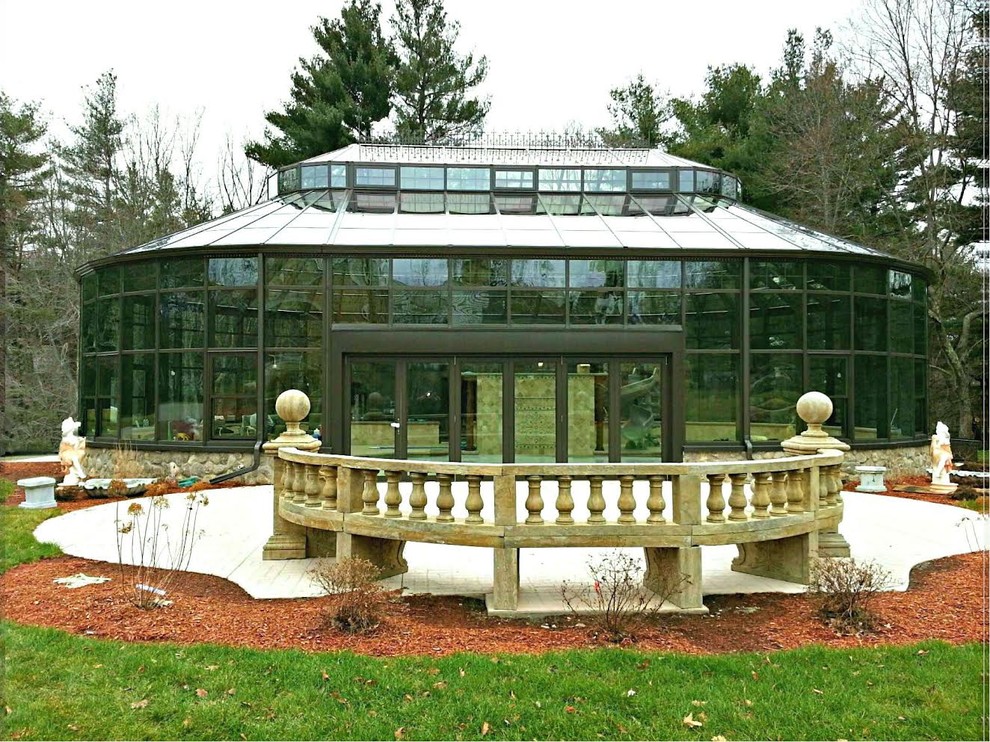 Diseño de casa de la piscina y piscina tradicional grande redondeada y interior con adoquines de ladrillo