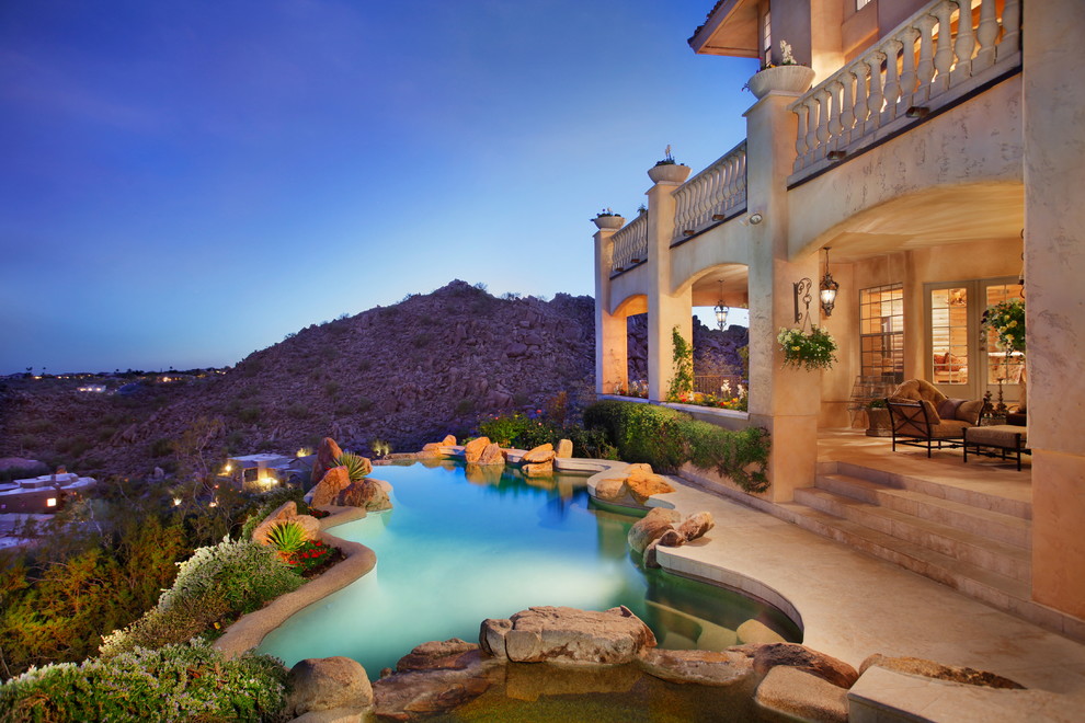 Design ideas for a mediterranean custom shaped natural swimming pool in Nashville.