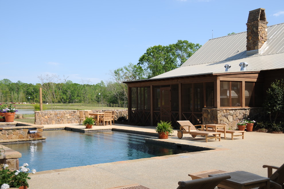 This is an example of a rural custom shaped swimming pool in New Orleans with decomposed granite.
