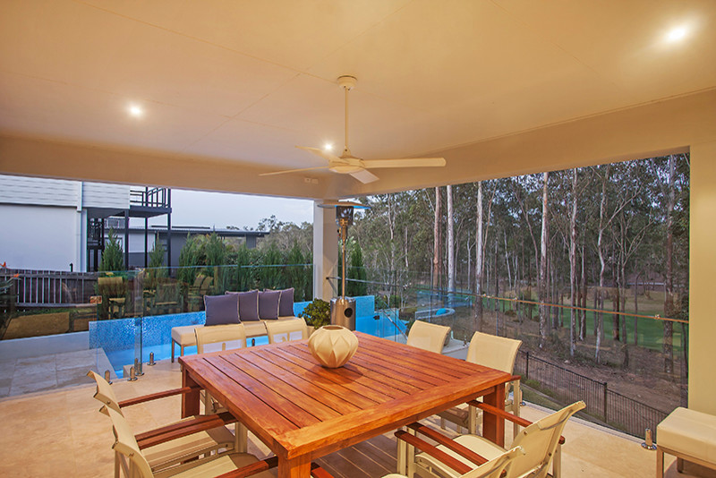 Mid-sized trendy backyard tile and rectangular aboveground pool fountain photo in Brisbane
