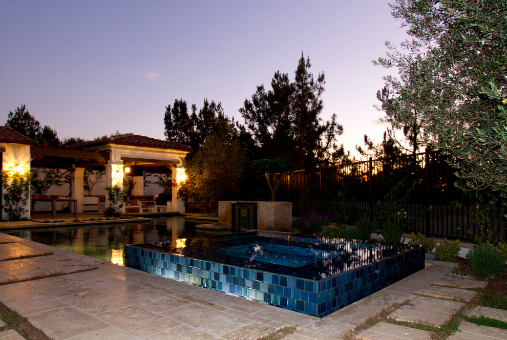 Inspiration for a rustic swimming pool in Orange County.
