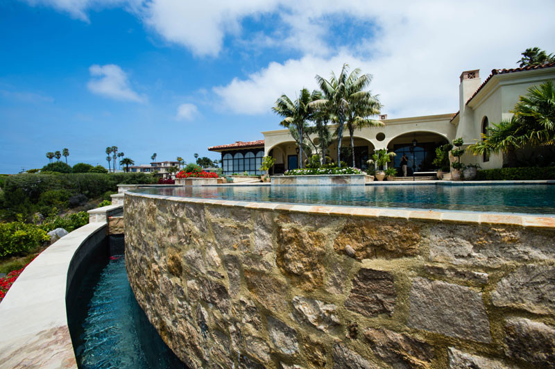 Island style pool photo in San Diego