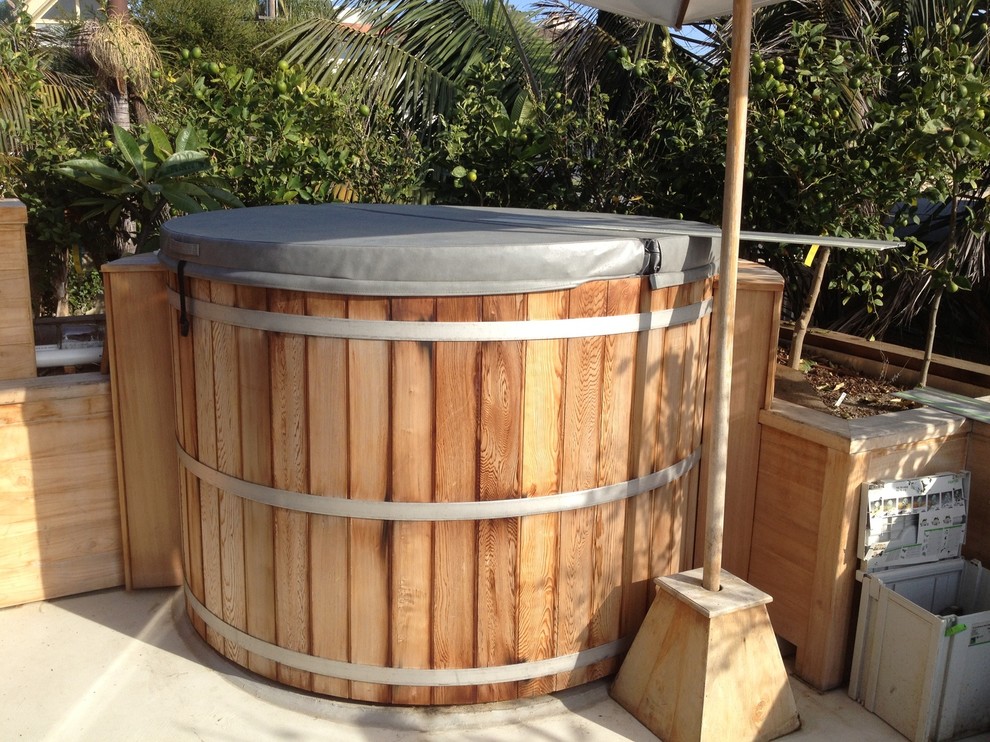 Design ideas for a small coastal back round above ground hot tub in San Diego with decking.