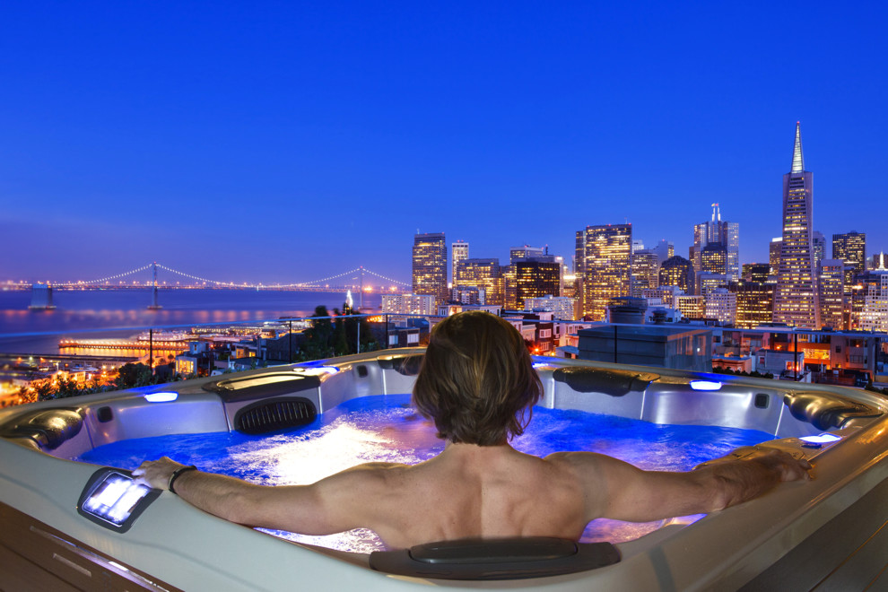 Inspiration for a contemporary back rectangular lengths hot tub in San Francisco with concrete slabs.