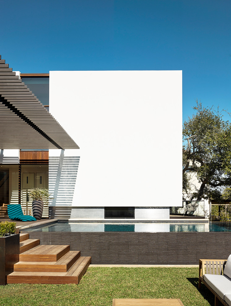 Contemporary rectangular above ground swimming pool in Austin.