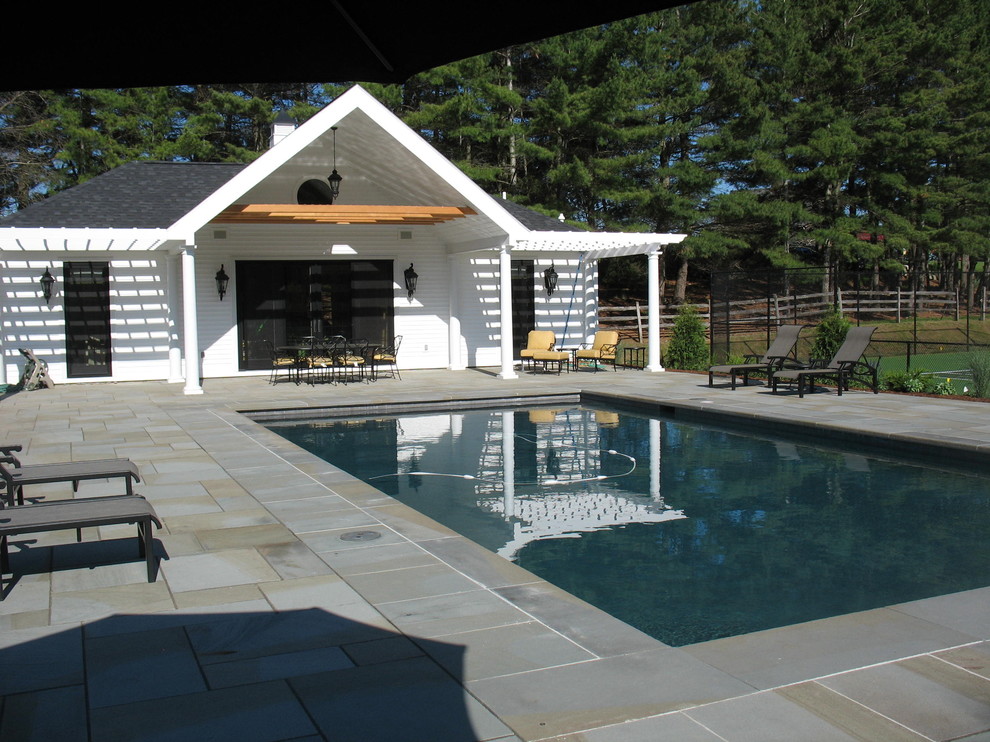 Inspiration for a medium sized classic back rectangular lengths swimming pool in Burlington with a pool house and concrete paving.