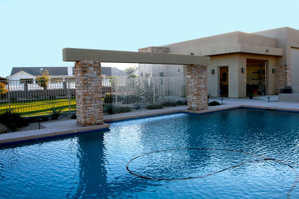 Trendy backyard pool photo in Phoenix
