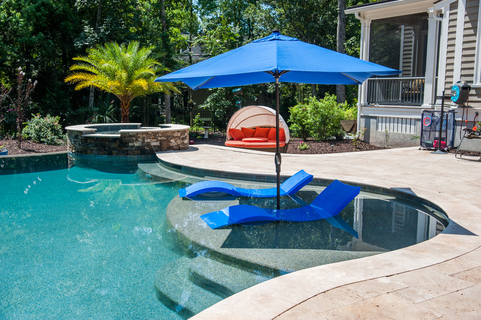 Example of a large classic backyard custom-shaped aboveground hot tub design in Charleston