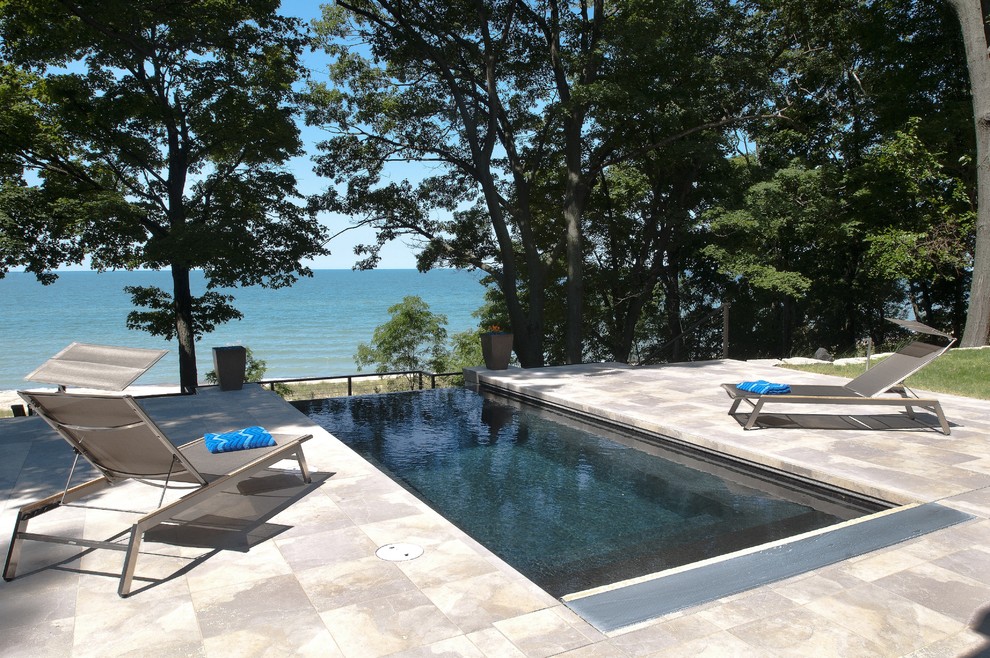 Inspiration for a large contemporary rectangular infinity pool remodel in Grand Rapids