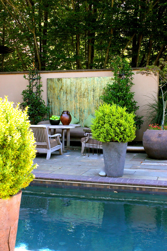 Example of an eclectic rectangular pool design in Portland