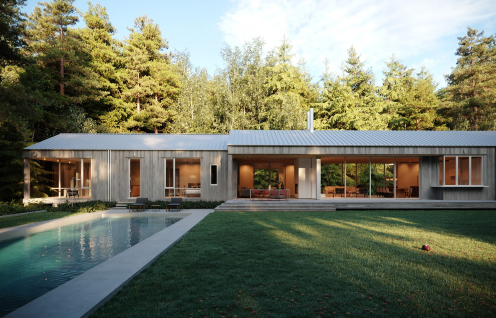 Modelo de piscina alargada minimalista grande rectangular en patio lateral con privacidad y losas de hormigón