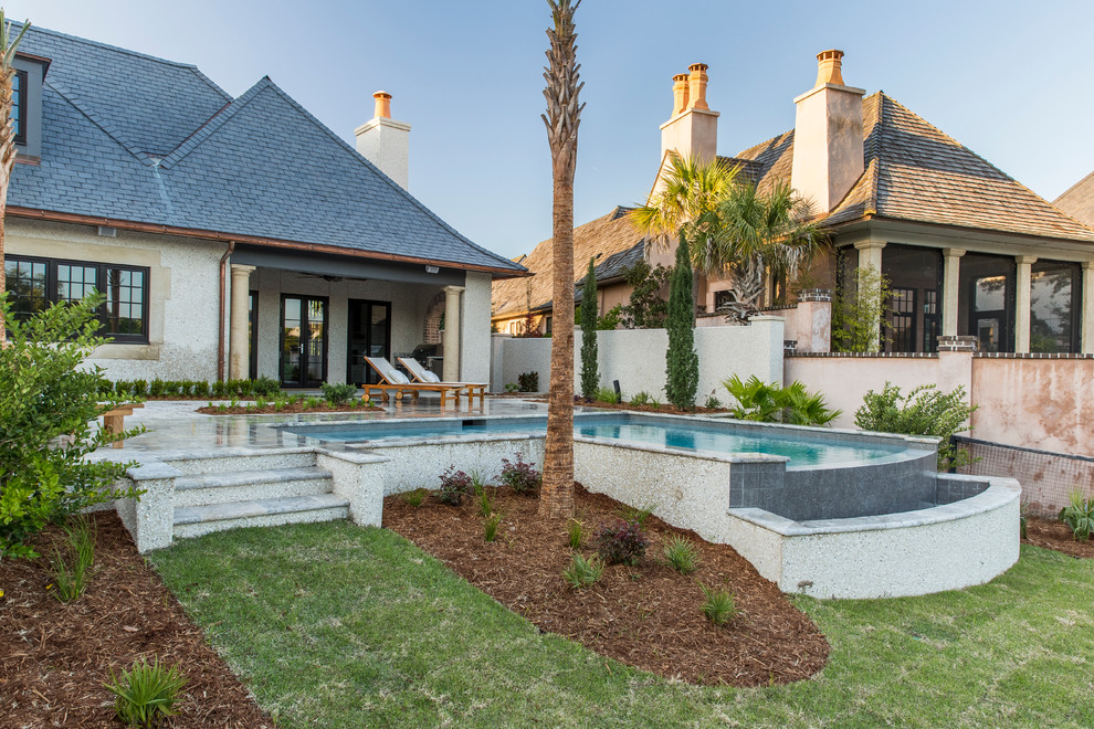 Inspiration for a small timeless backyard stone and l-shaped infinity pool remodel in Charleston