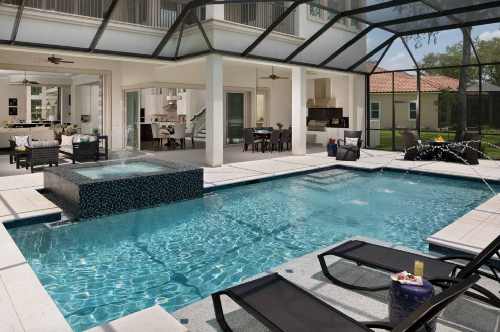 Diseño de piscina con fuente alargada contemporánea grande rectangular en patio trasero con adoquines de hormigón