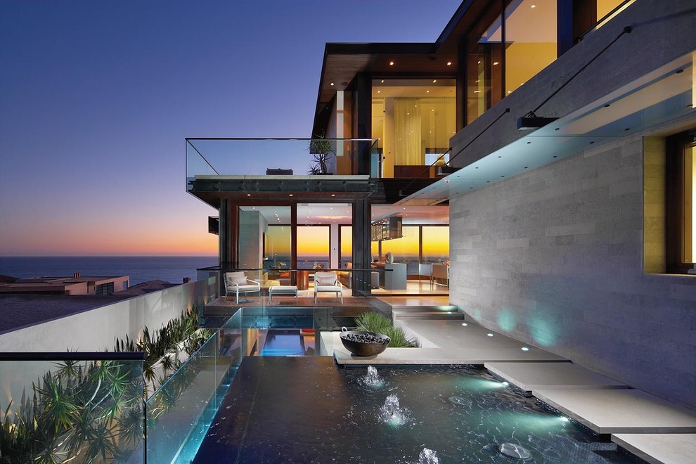 Photo of a contemporary back custom shaped swimming pool in Orange County.