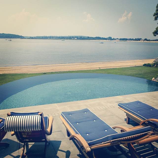 Centre Island Vanishing Edge Traditional Swimming Pool & Hot Tub