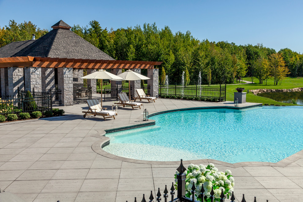 Elegant custom-shaped pool photo in Philadelphia