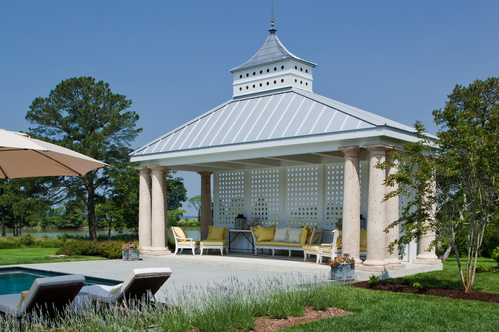 Mid-sized cottage backyard rectangular and concrete lap pool house photo in Baltimore