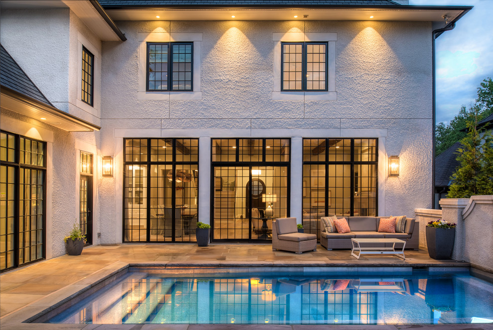 Pool - transitional backyard rectangular pool idea in Charlotte