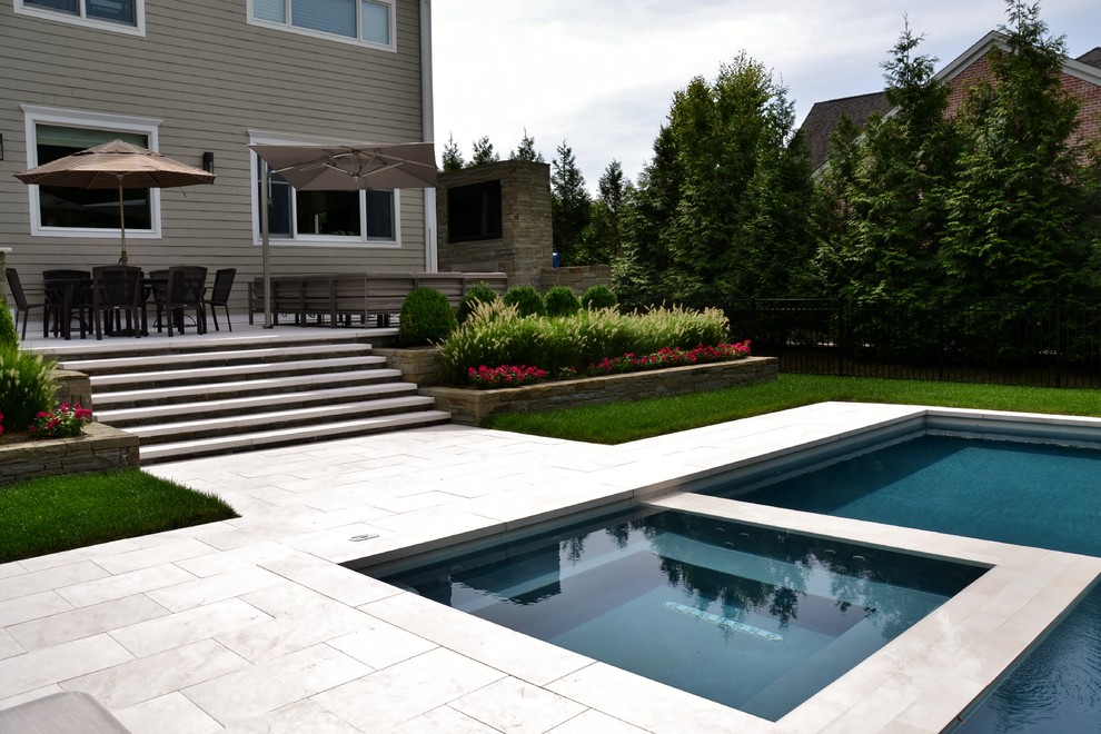 Inspiration for a large modern backyard rectangular lap pool remodel in New York