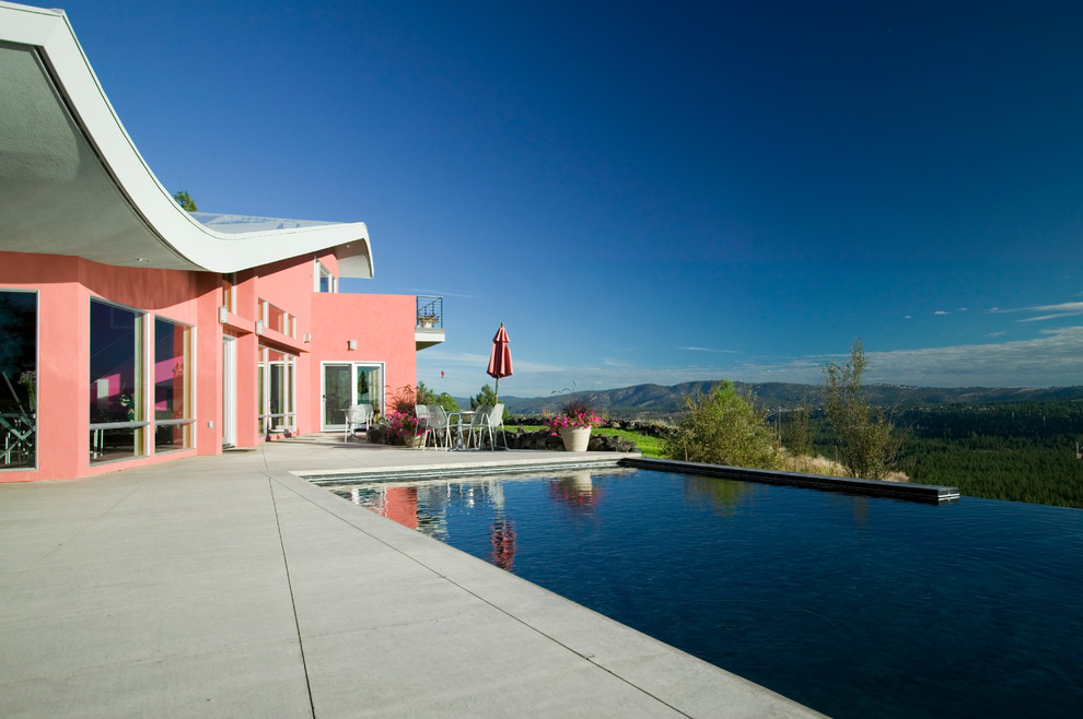 Inspiration for a contemporary infinity pool remodel in Seattle