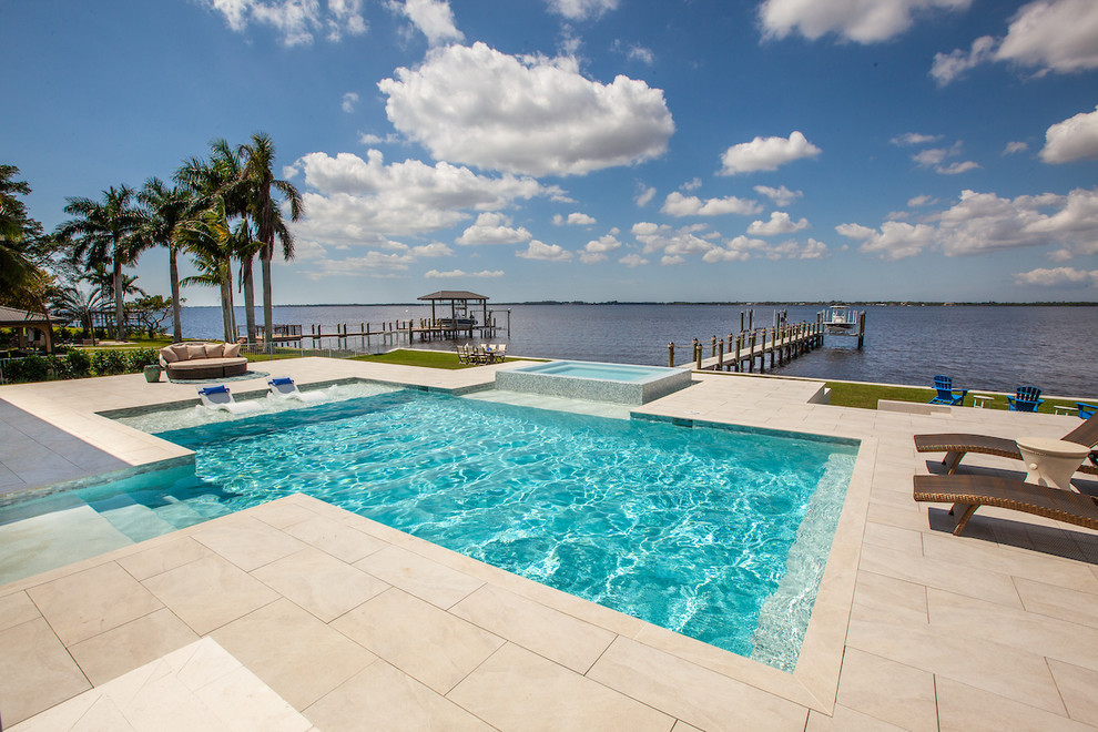 Inspiration for a medium sized modern rectangular swimming pool in Miami with tiled flooring.