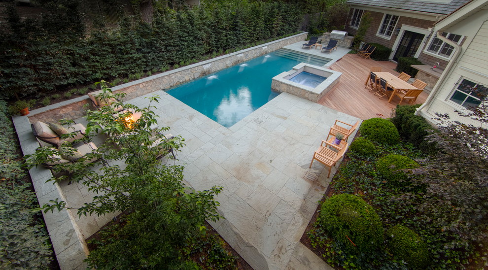 Mid-sized transitional backyard rectangular hot tub photo in Toronto with decking