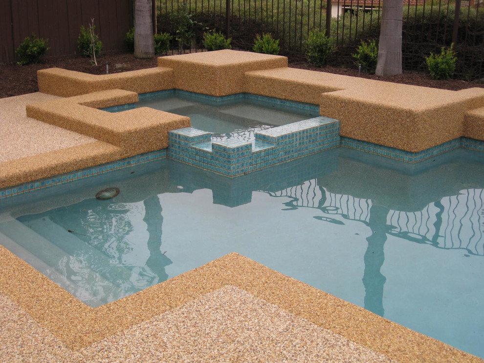 Inspiration for a small contemporary back rectangular lengths hot tub in Los Angeles with stamped concrete.