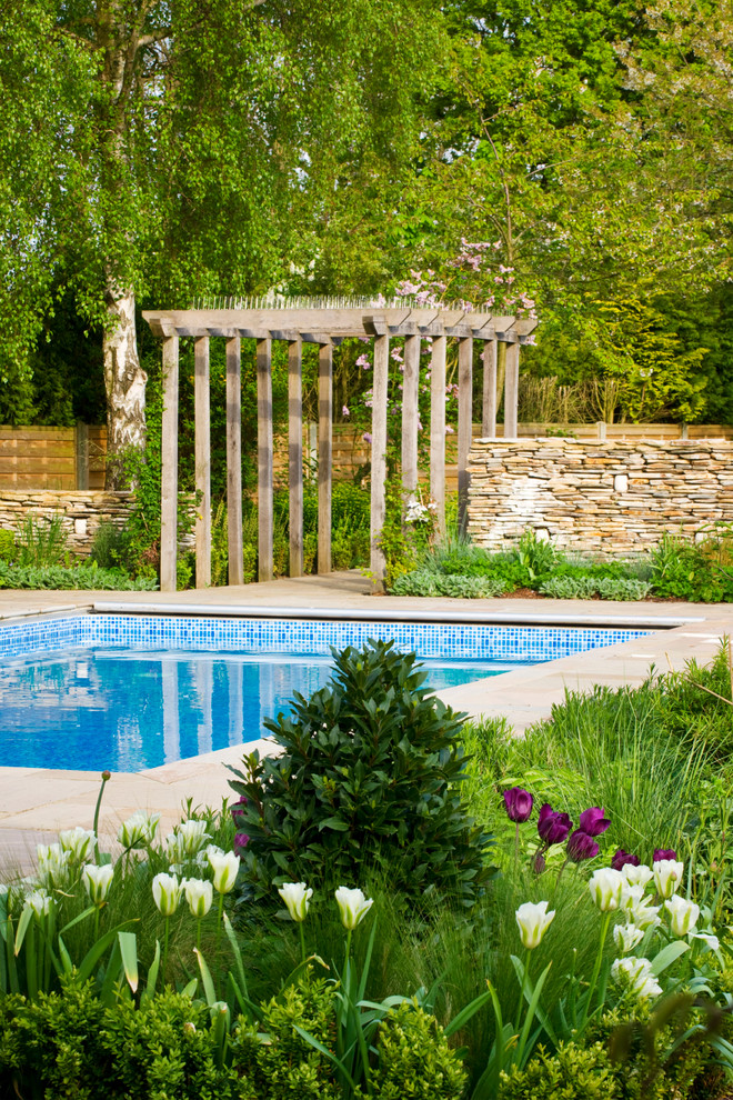 Trendy rectangular pool photo in Hertfordshire