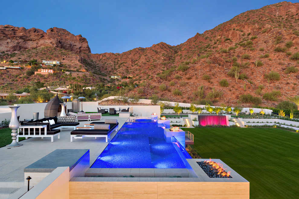 Inspiration for a mid-sized contemporary rooftop stone and rectangular infinity pool remodel in Phoenix