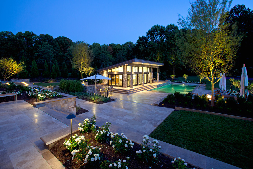 Photo of a large contemporary back rectangular natural swimming pool in DC Metro with a pool house and tiled flooring.