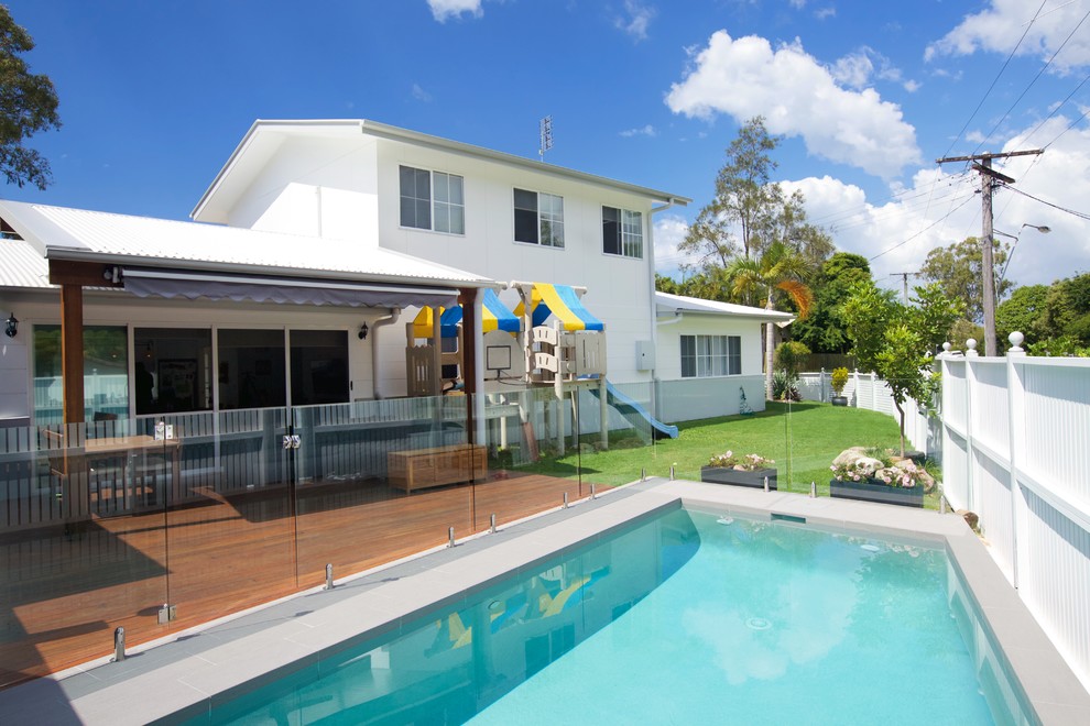 Inspiration for a medium sized modern side rectangular lengths swimming pool in Sunshine Coast with tiled flooring.