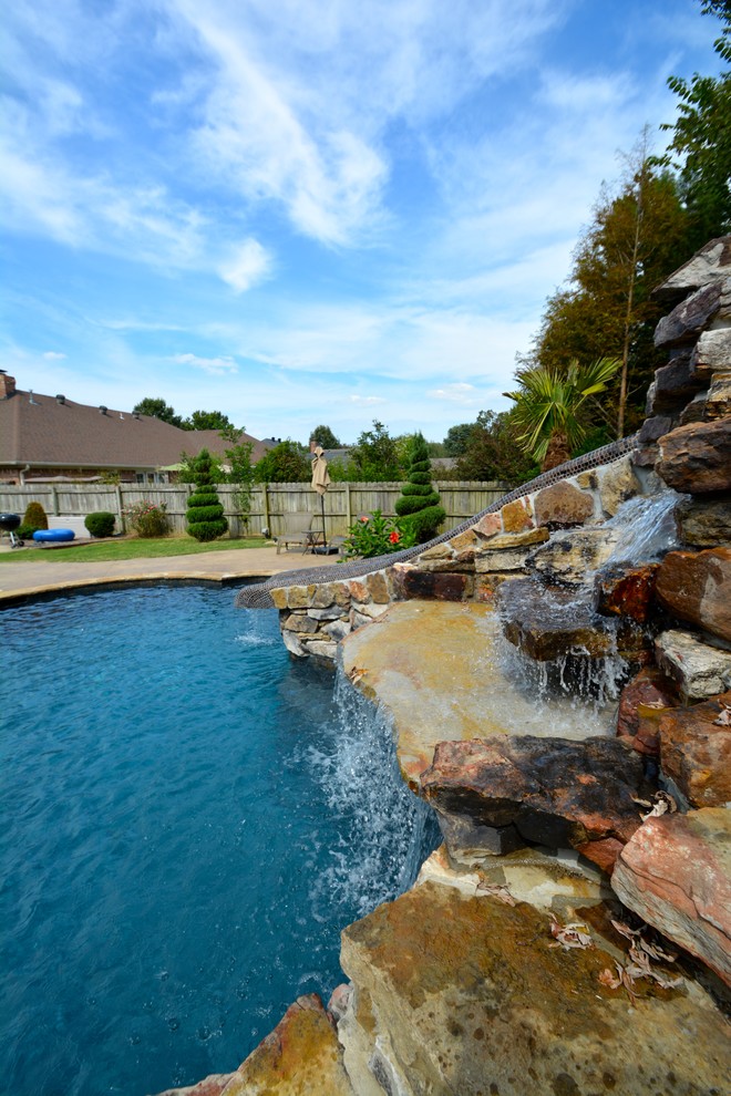 Mid-sized mountain style backyard custom-shaped and stone lap water slide photo in Little Rock