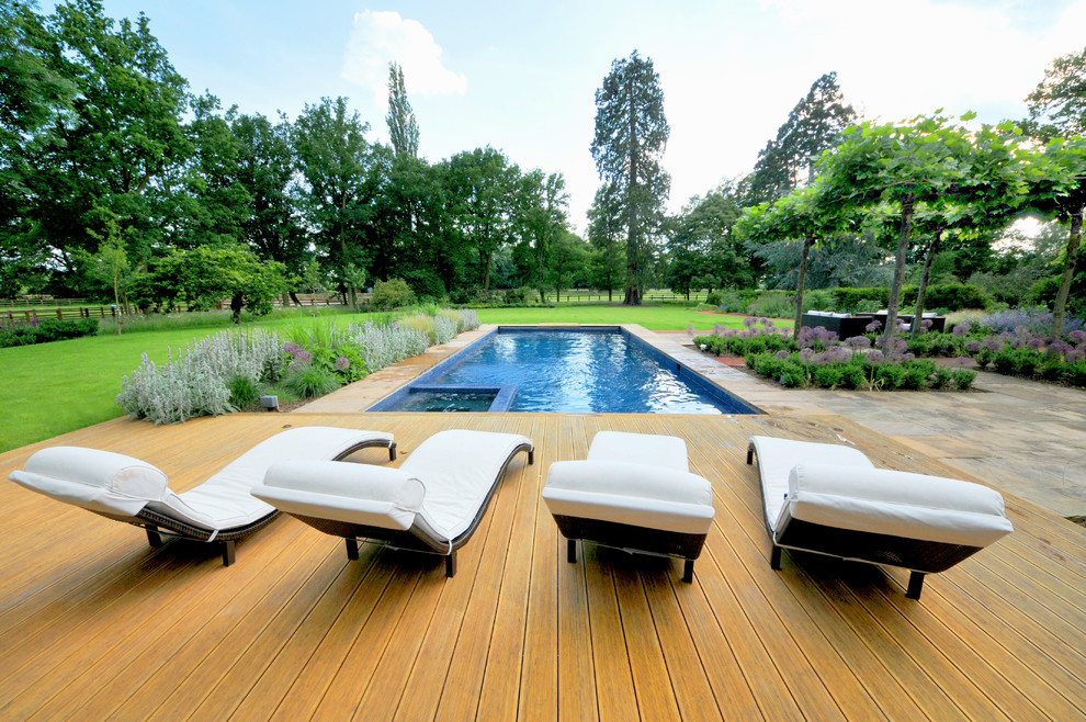 Photo of a traditional swimming pool in Hampshire with decking.