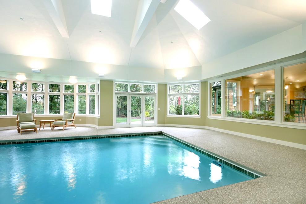 Inspiration for a bohemian indoor rectangular swimming pool in Boston with a pool house.