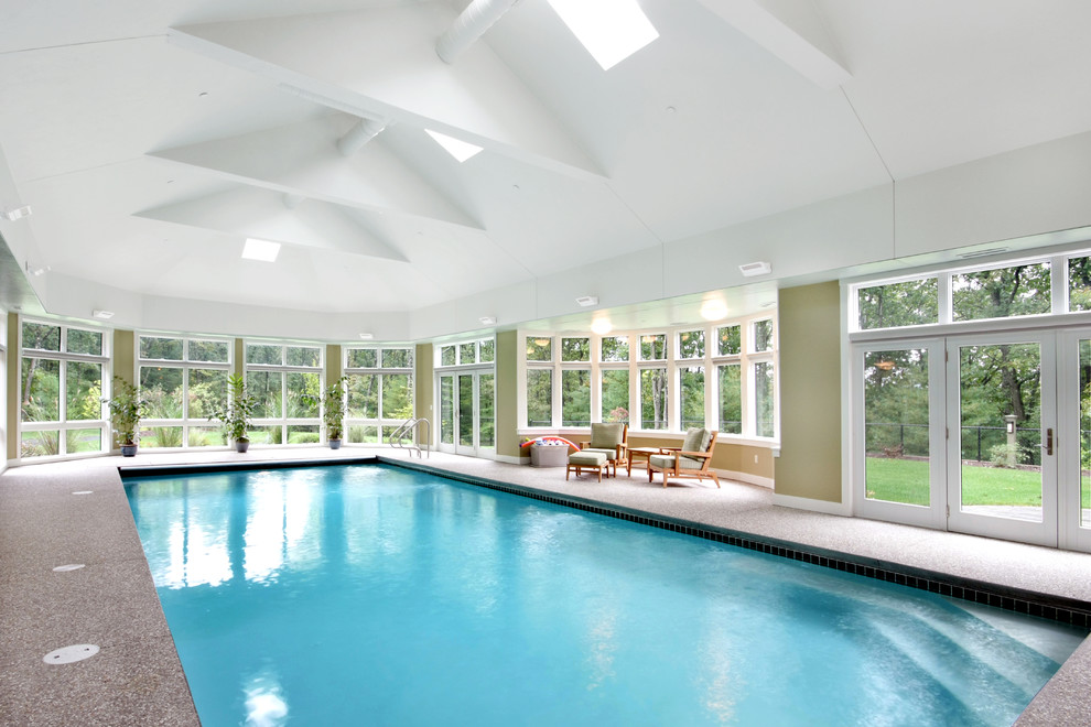 Example of an eclectic indoor rectangular pool design in Boston
