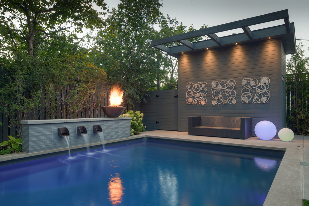 Inspiration for a mid-sized contemporary backyard concrete paver and rectangular lap pool fountain remodel in Toronto