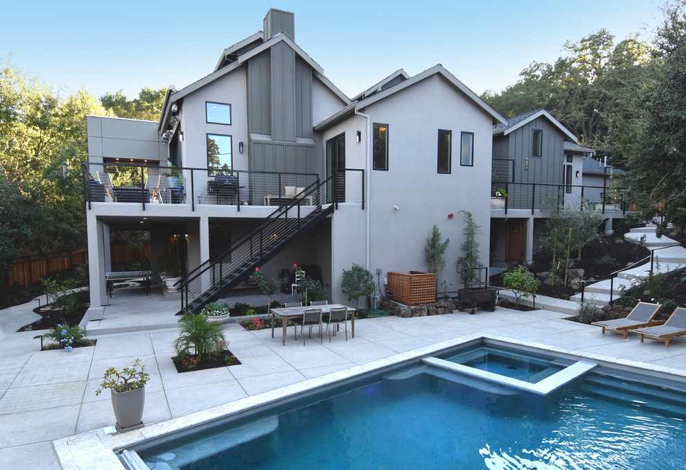Large farmhouse backyard concrete and rectangular aboveground pool fountain photo in San Francisco